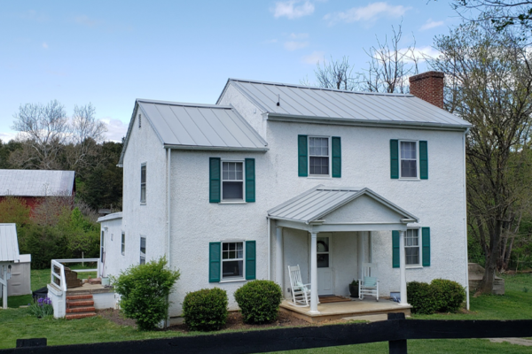 White home with grey metal roof