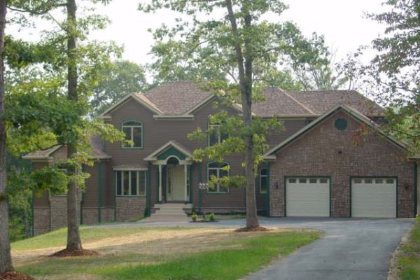 Large home with shingled roof